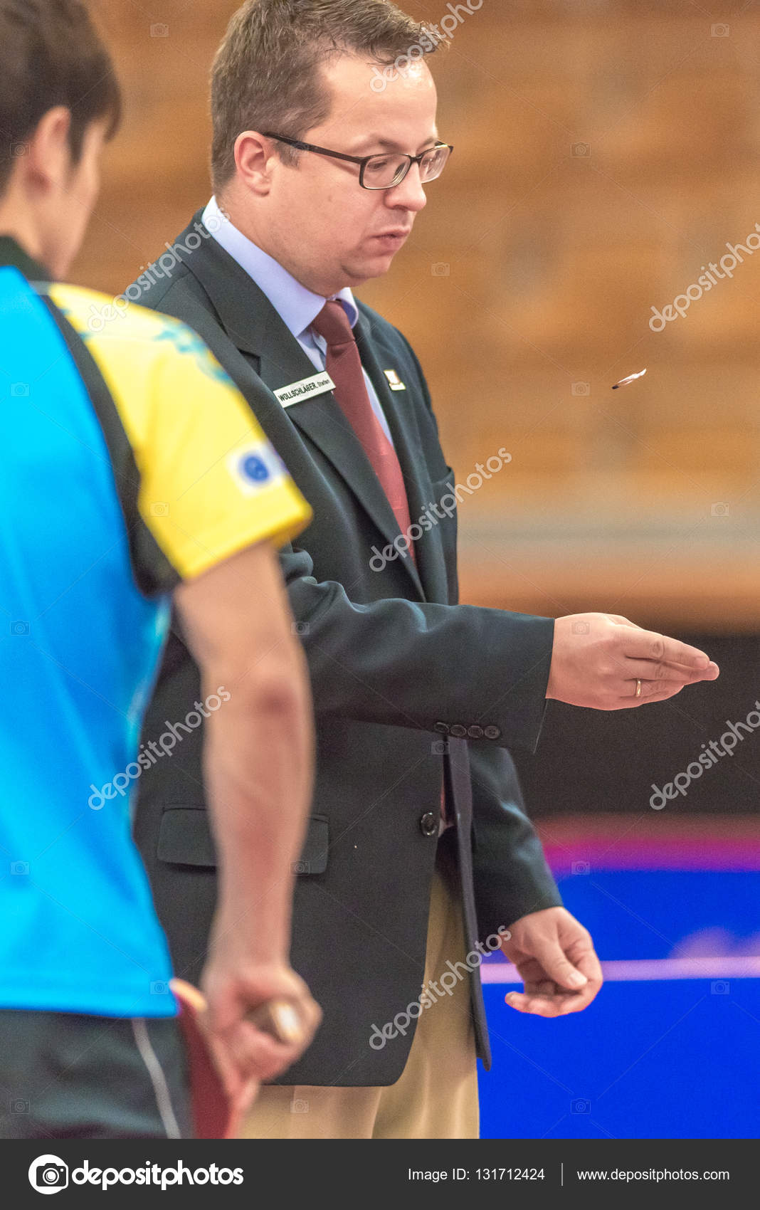 Referee flipping a coin at the table tennis tournament SOC at th