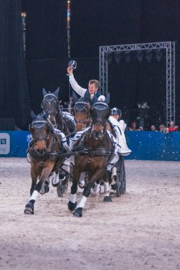 Kucak kazanan Boyd Exell Fei Dünya Kupası Drivi, şeref