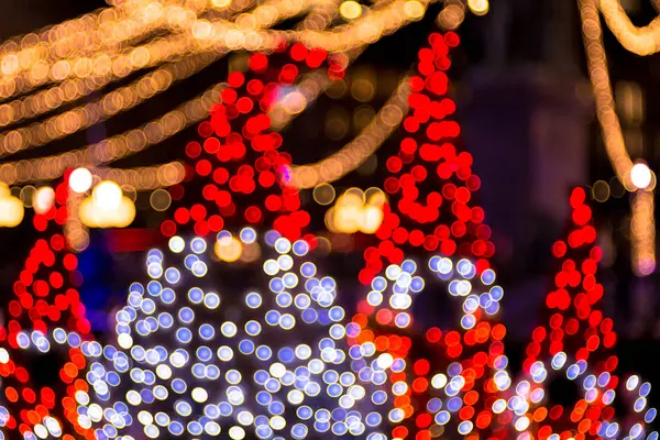 Lights defocused during christmas in city — Stock Photo, Image