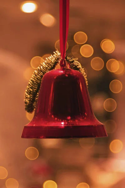Red bells in a window decoration during christmas with great bok — Stock Photo, Image