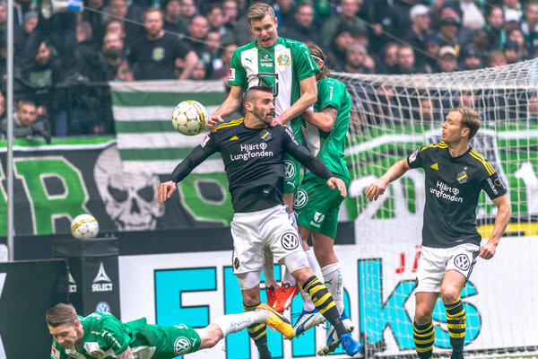 Rough play at the derby match between AIK and Hammarby IF at the