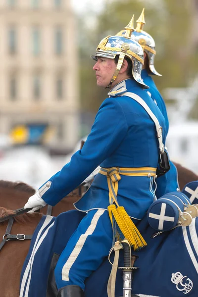 Royal mounted guards in blue passing by on horse — Stock Photo, Image