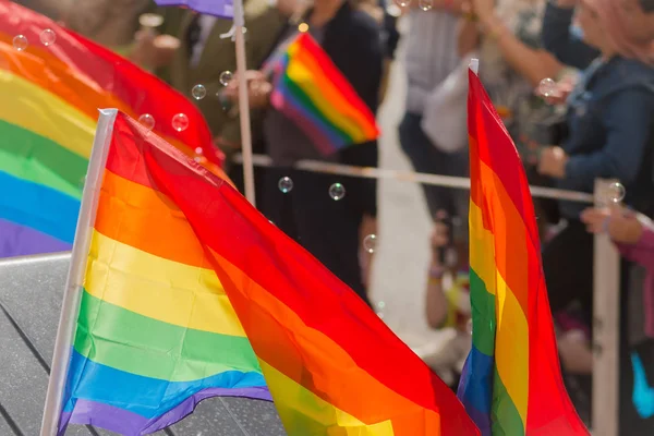 Closeup of Rainbow flags at the Pride parade in Stockholm with h — Stock Photo, Image