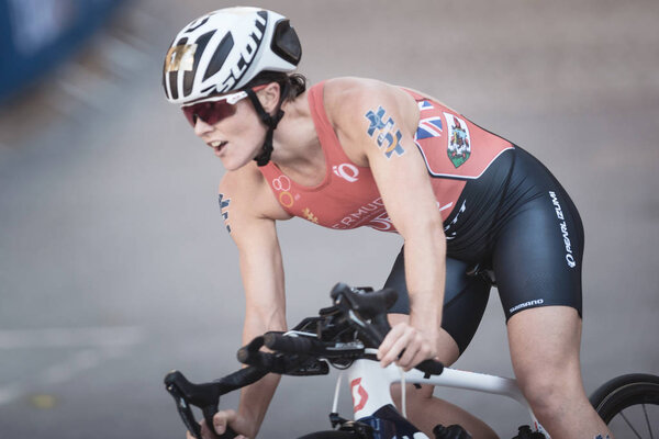 Closeup of Flora Duffy (BER) cycling in the womens ITU triathlon