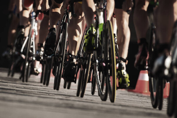 Closeup of triathletes on bikes in the ITU triathlon series for 