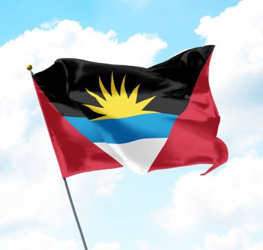 Antigua ve Barbuda Ulusal Bayrağı Gökyüzü ve Arkaplanda Bulutlarla Yükseldi