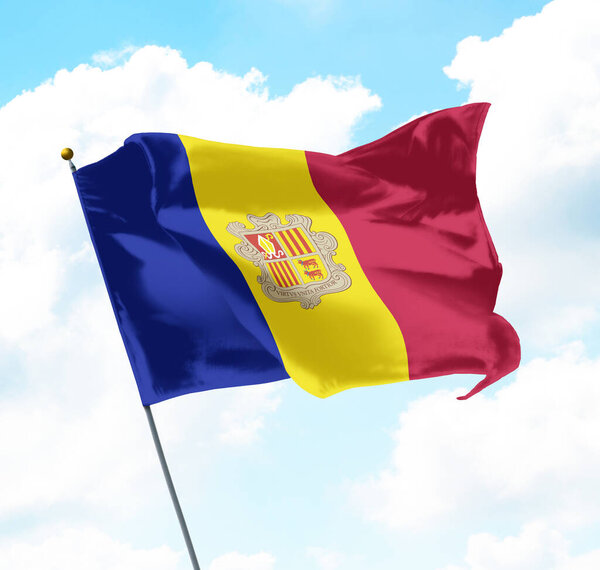 National Flag of Andorra Raised Up with Sky and Clouds in Background