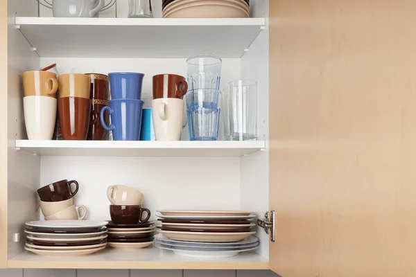 Kitchen cabinet or cupboard for dishes Stock Photo by ©buecax