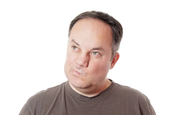 Skeptical man twisting his mouth — Stock Photo, Image