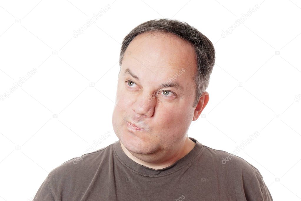Skeptical man twisting his mouth — Stock Photo © buecax #129974110