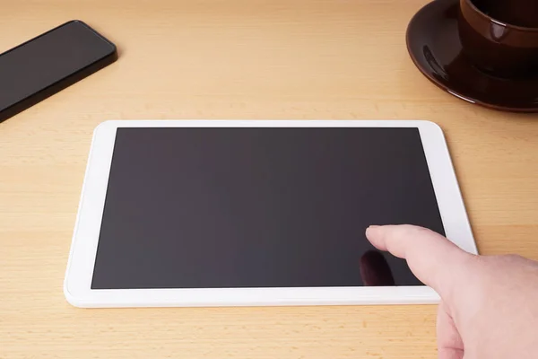 Finger touching blank touchscreen on tablet computer — Stock Photo, Image