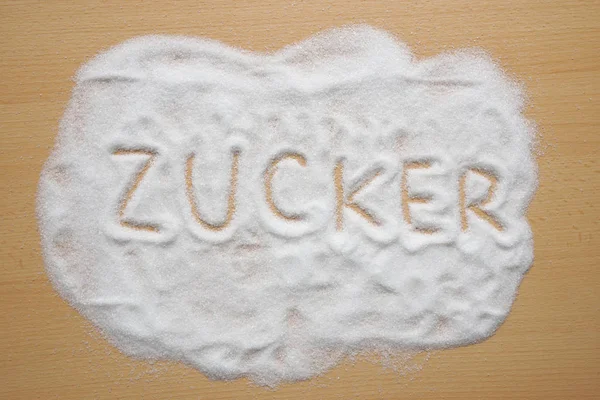 Parola tedesca Zucker scritta in zucchero — Foto Stock