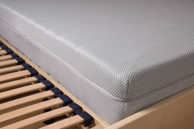 cold foam mattress on slatted frame clipart