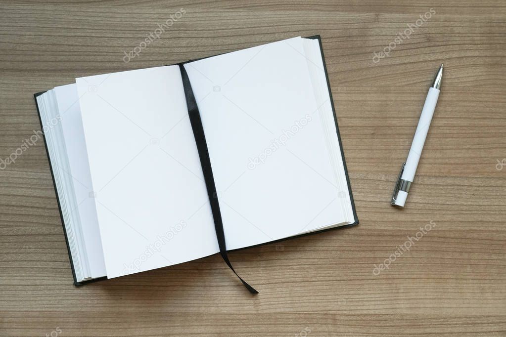 notebook and pen on desk