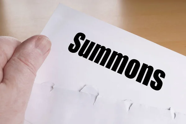 Hand holding summons letter — Stock Photo, Image