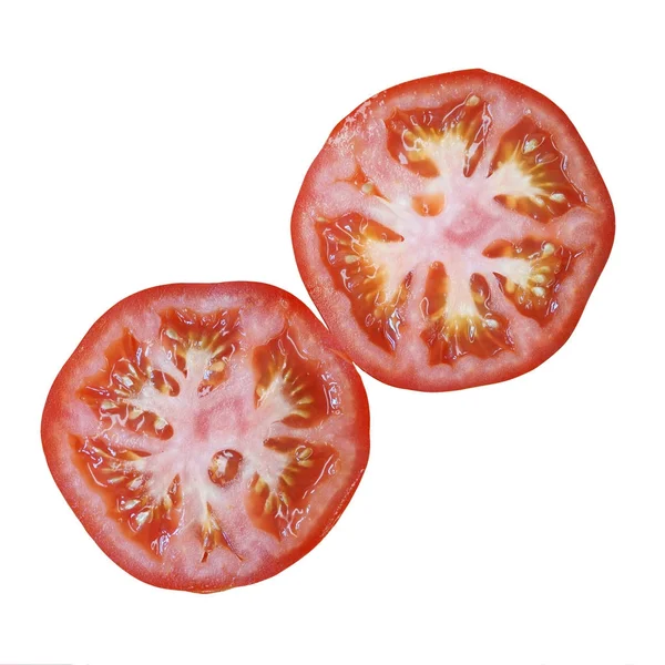 Два кусочка томата изолированы — стоковое фото
