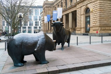 Bull and bear sculpture in front of historic Frankfurt Stock Exchange building clipart