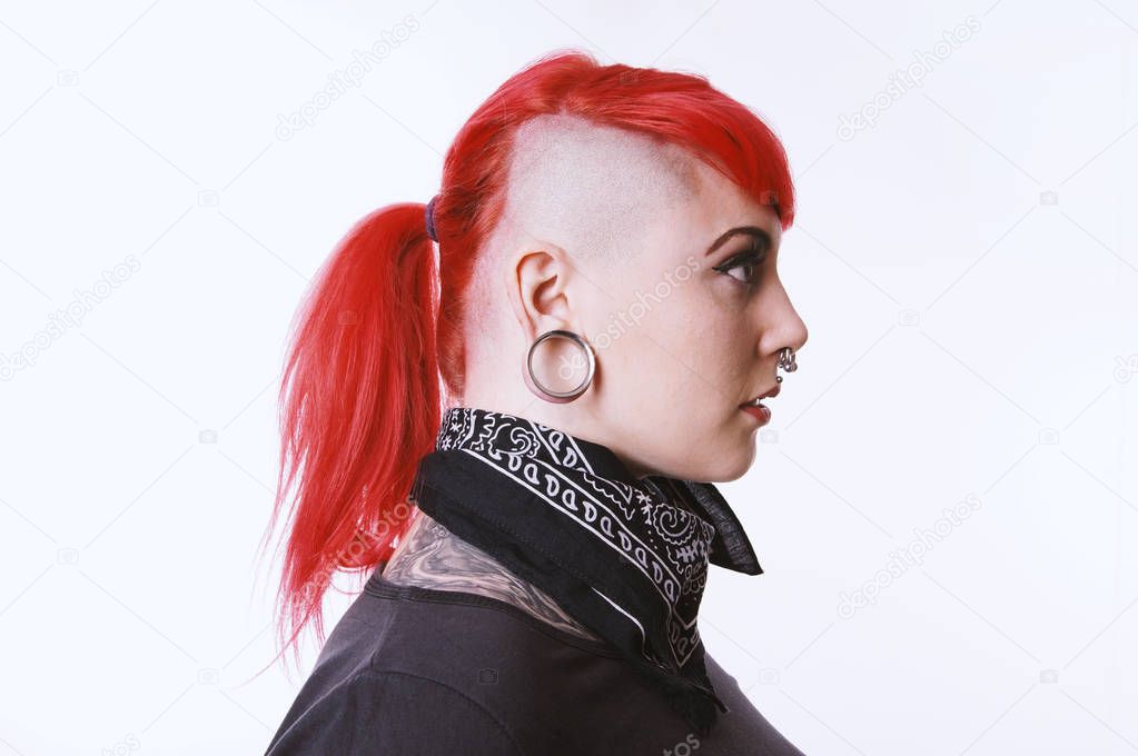 girl with sidecut piercings and tattoos