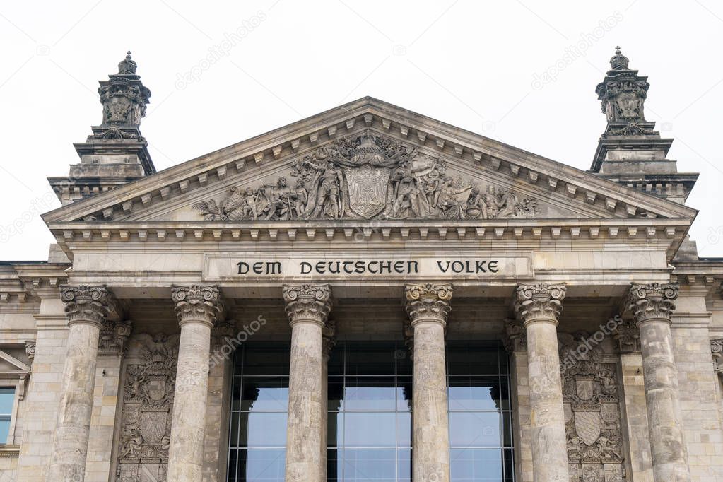 German inscription Dem Deutschen Volke, meaning To The German People, on the portal of Bundestag or Reichstag building in Berlin, Germany