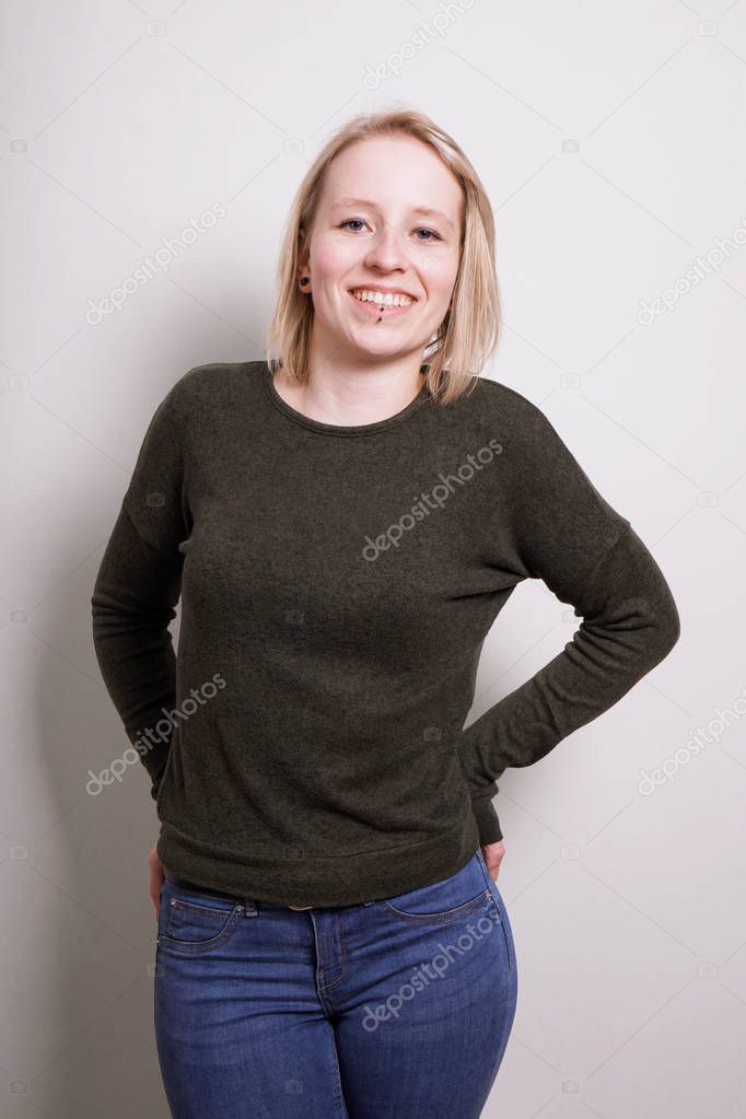 young blond millennial woman smiling
