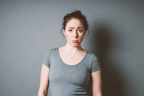 Sulky pouting young woman feeling letdown and disappointment — Stock Photo, Image