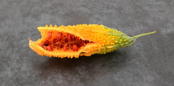 Orange Bitter Gourd Ridged Flesh Split Open Show Red Seeds — Stock Photo, Image