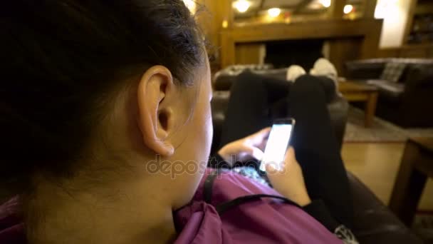 Girl Using Smartphone Sitting Sofa Hotel — Stock Video