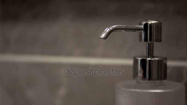 A hand soap with pumping lotion from bottle. Male hands using wash hand sanitizer gel pump dispenser. cinematic dof — Stock Footage Hand Soap Pumping Lotion Bottle Male Hands Using Wash Hand Royalty Free Stock Footage