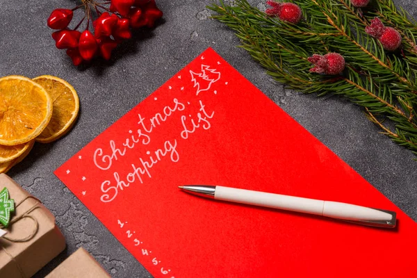 Christmas Shopping list on desk — Stock Photo, Image