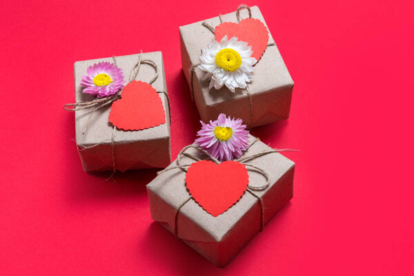 Valentine day three gift boxes on red background