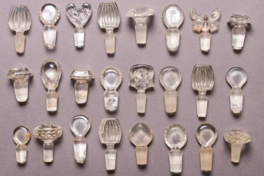 Lot of antique glass bottle stoppers clipart