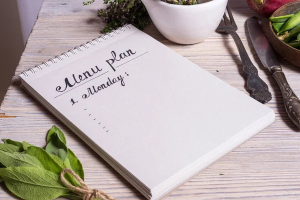 Menu planning on wooden table — Stock Photo, Image
