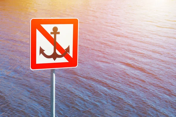 Sign next to water, Anchoring forbidden — Stock Photo, Image