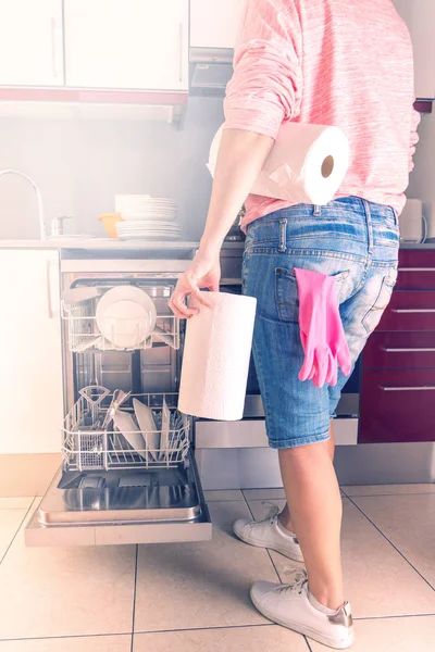 Woman going to start work with washing machine