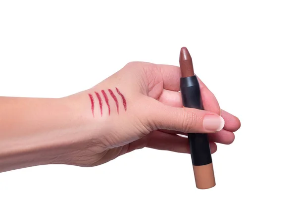 Tests Lippenstift Schläge auf der Hand, verschiedene Farben, isoliert — Stockfoto