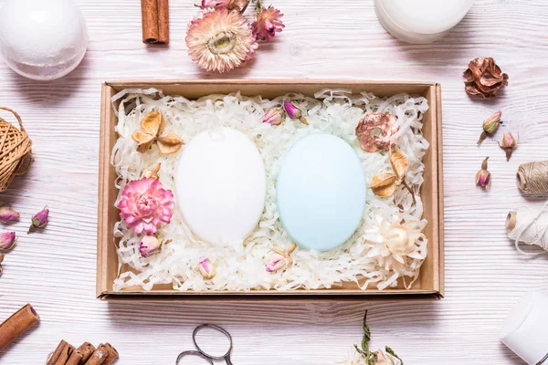 Natural homemade soap in cardboard box on wooden table — Stock Photo, Image