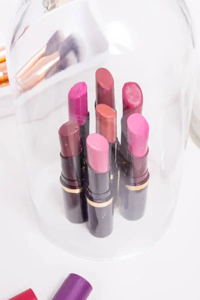 Set of different lipsticks on cosmetic table — Stock Photo, Image