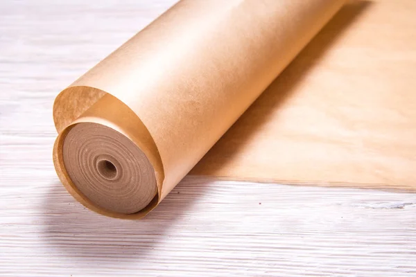 Roll of baking paper on wooden background — 스톡 사진