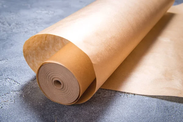 Roll of baking paper on dark background — 스톡 사진