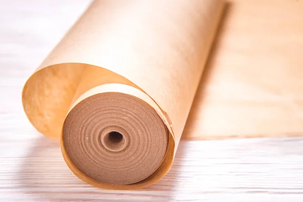 Roll of baking paper on wooden background — 스톡 사진