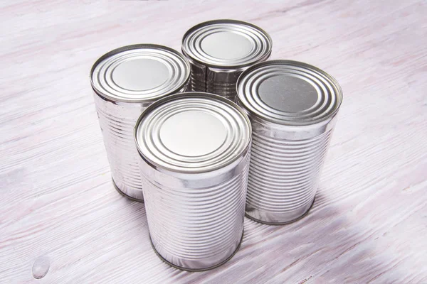 Set of metal tin cans on wooden table — 스톡 사진