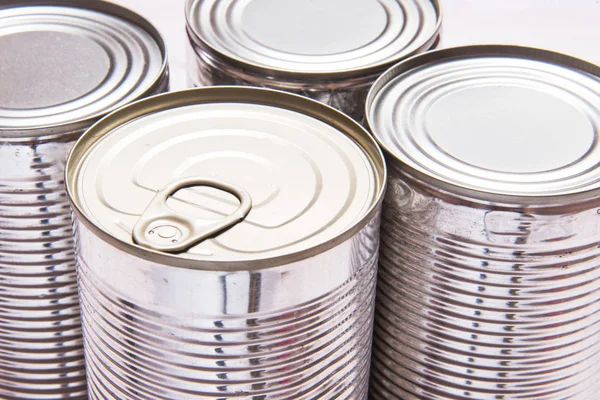 Set of metal tin cans on wooden table ストック画像