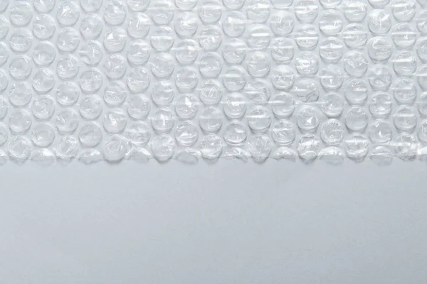 Textured background packaging material, bubble film