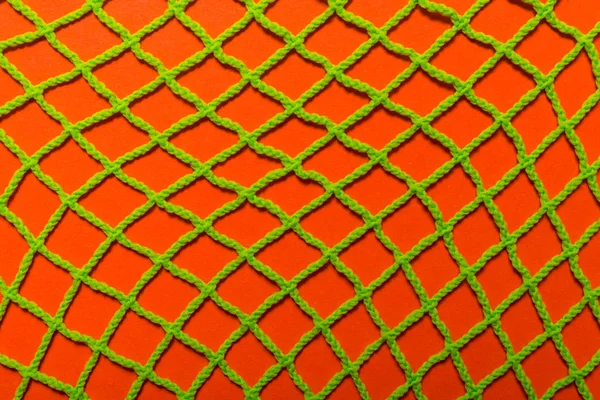 textile mesh, green and orange color, textured background