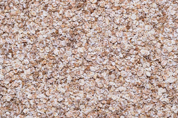 Oat flakes  close up, textured background — 스톡 사진