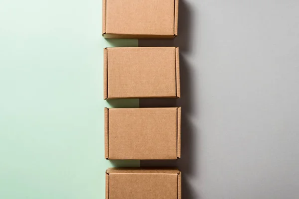 Set of brown carton boxes on blue background, copy space