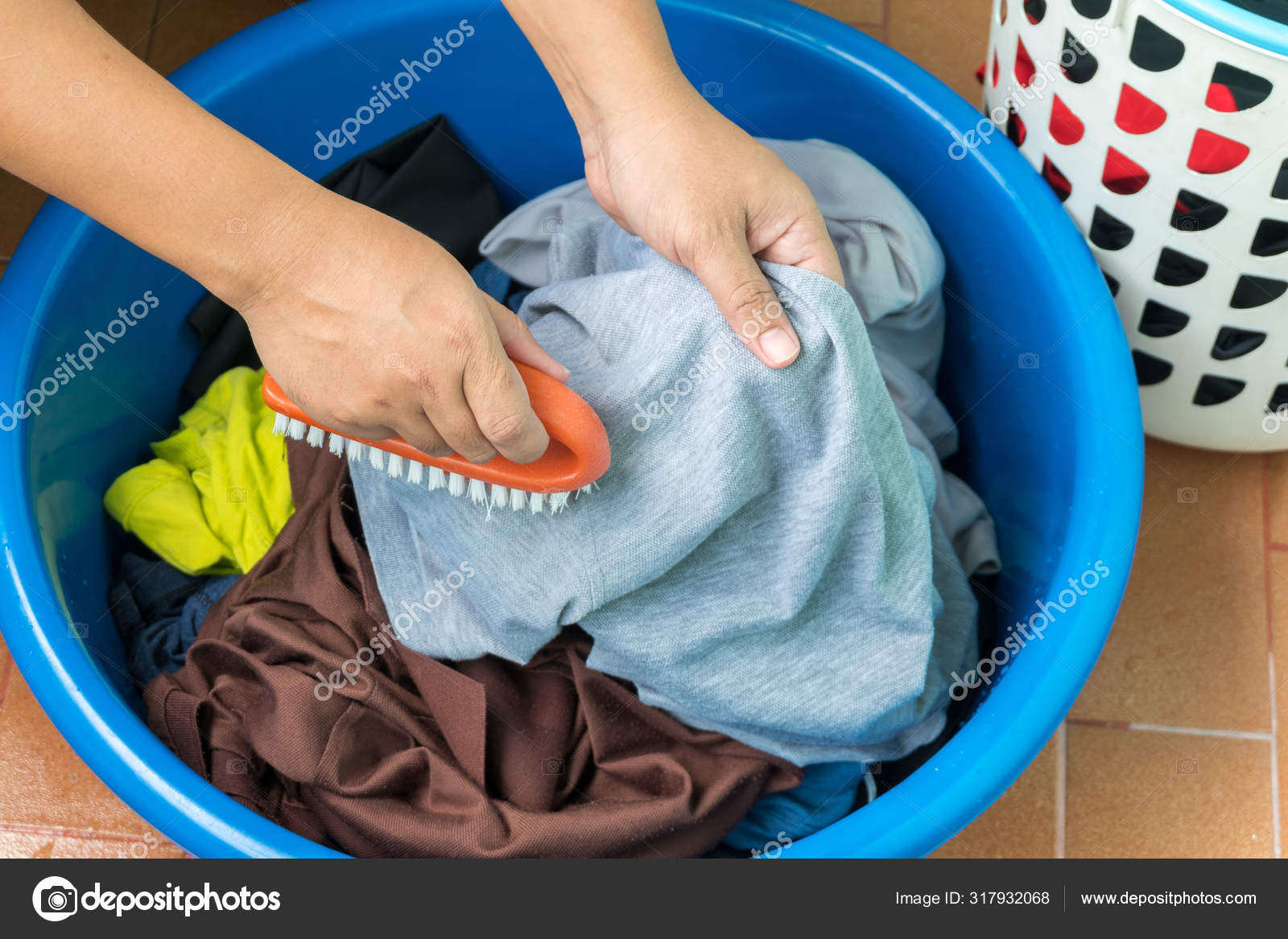 https://st3.depositphotos.com/17835736/31793/i/1600/depositphotos_317932068-stock-photo-women-separate-cloth-from-basket.jpg