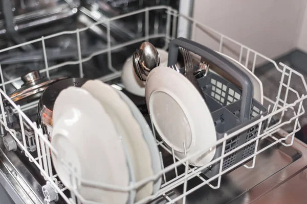 Open dishwasher with clean glass and dishes, selective focus — Stock Photo, Image