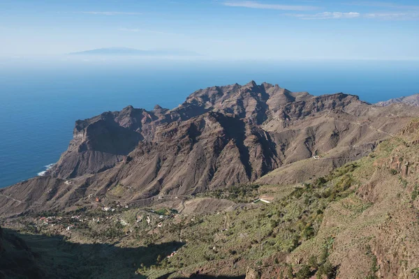 La Gomera landscape, breath taking Canyons and cliffs with La Palma island in the background, Canary islands, Spain.