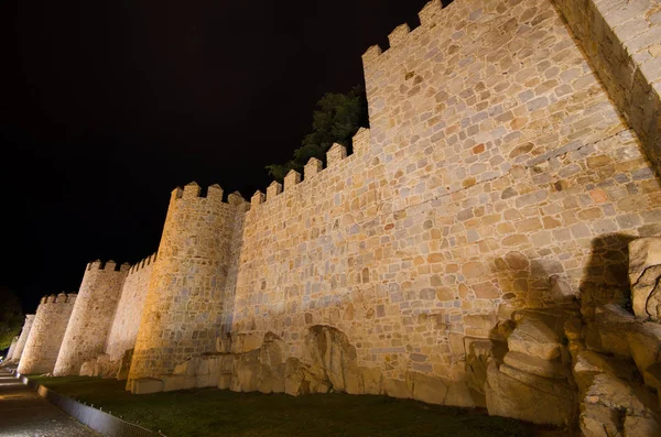 Night scene of famous Avila city walls in Castilla y Leon, Spain